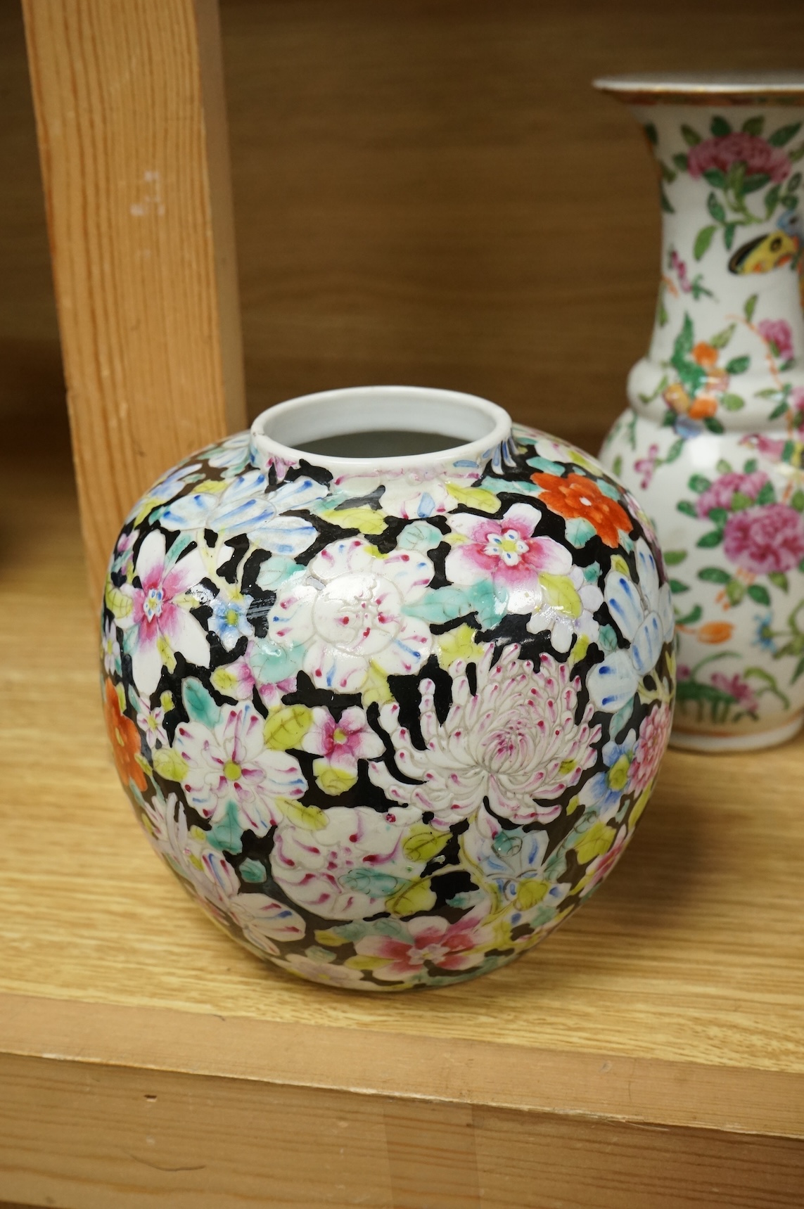 A Chinese 'Thousand Flower' jar, two famille rose vases, and a Republic period jar and cover, largest 19cm high